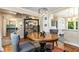 Open dining space featuring a round table, custom shelving, and seamless transition to other living areas at 1071 Standard Ne Dr, Brookhaven, GA 30319