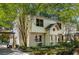 Charming two-story home with a brick foundation, a well-manicured lawn, and mature trees at 1071 Standard Ne Dr, Brookhaven, GA 30319