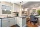 Bright kitchen featuring stainless appliances, granite counters, and seamless flow to the dining space at 1071 Standard Ne Dr, Brookhaven, GA 30319