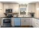 Charming kitchen with stainless appliances, granite counters, and ample cabinet space for organized storage at 1071 Standard Ne Dr, Brookhaven, GA 30319