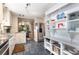 Updated kitchen with stainless steel appliances, granite counters, and built-in shelving for added storage at 1071 Standard Ne Dr, Brookhaven, GA 30319