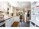 Modern kitchen featuring stainless steel appliances, granite counters, and an open flow to the dining area at 1071 Standard Ne Dr, Brookhaven, GA 30319