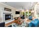 Inviting living room with hardwood floors, a fireplace, and double doors leading to a patio at 1071 Standard Ne Dr, Brookhaven, GA 30319