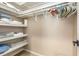 Walk-in closet featuring ample shelf space, hanging rods, and an organized storage solution at 1071 Standard Ne Dr, Brookhaven, GA 30319