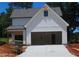 Spacious two car garage with driveway on a newly constructed home at 137 Old Alabama Rd, Emerson, GA 30137