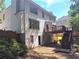 Rear exterior of home featuring a deck and a patio, perfect for outdoor gatherings at 2674 Misty Rock Cv, Dacula, GA 30019