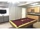 Finished basement featuring a pool table, wet bar, and sitting area, perfect for entertaining at 2674 Misty Rock Cv, Dacula, GA 30019