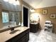 Dual vanity bathroom with a tub, separate shower, tiled floors, and bright lighting at 2674 Misty Rock Cv, Dacula, GA 30019