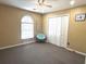 Bedroom featuring a large window, closet and a modern chair at 2674 Misty Rock Cv, Dacula, GA 30019