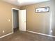 Cozy bedroom featuring carpeted floors and tan walls at 2674 Misty Rock Cv, Dacula, GA 30019