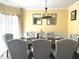 Beautiful dining room with an elegant table setting, sophisticated chairs, and neutral decor at 2674 Misty Rock Cv, Dacula, GA 30019