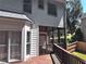 Exterior view of a home with a screened in porch and wooden deck at 2674 Misty Rock Cv, Dacula, GA 30019