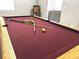 Game room boasting a full-size pool table with plush red felt, ideal for friendly competition at 2674 Misty Rock Cv, Dacula, GA 30019