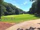 Beautiful golf course with lush green fairways, surrounded by mature trees on a sunny day at 2674 Misty Rock Cv, Dacula, GA 30019