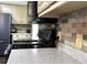 Kitchen with granite countertops, stainless steel appliances and neutral backsplash at 2674 Misty Rock Cv, Dacula, GA 30019