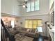 Spacious living room featuring high ceilings, neutral tones, and ample natural light at 2674 Misty Rock Cv, Dacula, GA 30019