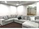 Large gray sectional sofa in living room, pool table in next room at 2674 Misty Rock Cv, Dacula, GA 30019