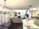 Open living space with hardwood floors, fireplace, adjacent to a modern kitchen with lots of light at 2674 Misty Rock Cv, Dacula, GA 30019