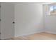 Bright bedroom with light hardwood floors and a window letting in natural light at 3735 Benchmark Dr, Atlanta, GA 30349
