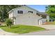 Two-story home with attached two-car garage, black shutters, and a freshly mowed lawn at 3735 Benchmark Dr, Atlanta, GA 30349