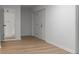Neutral hallway with light-colored floors, white walls, and updated trim and door casings at 3735 Benchmark Dr, Atlanta, GA 30349
