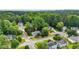 Drone shot of a suburban community with tree-lined streets and well-kept homes at 507 Huntgate Rd, Woodstock, GA 30189