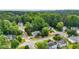 Aerial view of a neighborhood showcasing tree-lined streets and well-maintained homes in a suburban setting at 507 Huntgate Rd, Woodstock, GA 30189