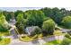Aerial view of a well-maintained home with mature trees and landscaping at 507 Huntgate Rd, Woodstock, GA 30189