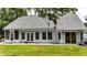 Well-maintained home exterior featuring white trim, many windows, and a well kept lawn at 507 Huntgate Rd, Woodstock, GA 30189