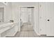 Bathroom with double vanity, tiled floors, a sliding door and toilet closet at 507 Huntgate Rd, Woodstock, GA 30189