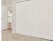 Neutral bedroom features a full-length closet with multiple doors for ample storage space at 507 Huntgate Rd, Woodstock, GA 30189