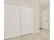 Neutral bedroom features a full-length closet with multiple doors for ample storage space at 507 Huntgate Rd, Woodstock, GA 30189