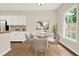 Cozy breakfast nook with bright window and seating for four at 507 Huntgate Rd, Woodstock, GA 30189