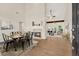 Open-concept dining room with fireplace and view of the living area at 507 Huntgate Rd, Woodstock, GA 30189