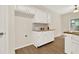Kitchen nook with white cabinets, butcher block countertops, and built-ins at 507 Huntgate Rd, Woodstock, GA 30189