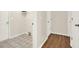 Laundry room with multiple access doors and neutral decor at 507 Huntgate Rd, Woodstock, GA 30189
