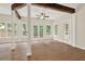 Spacious living room with wood floors, exposed beams, and natural light at 507 Huntgate Rd, Woodstock, GA 30189