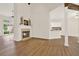 Bright living room features a fireplace, wood floors, and neutral paint at 507 Huntgate Rd, Woodstock, GA 30189