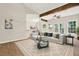 Bright living room with wood beams, many windows, and an open concept at 507 Huntgate Rd, Woodstock, GA 30189