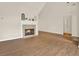 Bright living room features a fireplace, wood floors, and neutral paint at 507 Huntgate Rd, Woodstock, GA 30189