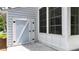 Shot of the side exterior of the home, shows storage shed and enclosed patio at 507 Huntgate Rd, Woodstock, GA 30189