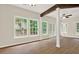 Bright sunroom with many windows and access to the backyard at 507 Huntgate Rd, Woodstock, GA 30189