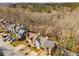 Aerial view of townhomes with lush trees offering a private view and neighborhood streets at 846 Brandy Oaks Ln, Stone Mountain, GA 30088