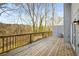 Large wooden deck with wooden railings perfect for outdoor entertaining and relaxation with views of the wooded lot at 846 Brandy Oaks Ln, Stone Mountain, GA 30088