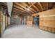 Large unfinished basement with exposed wood beams offering lots of potential to customize to your liking at 846 Brandy Oaks Ln, Stone Mountain, GA 30088