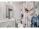 Updated bathroom with a stylish floral shower curtain, a modern vanity, and a neutral color palette at 846 Brandy Oaks Ln, Stone Mountain, GA 30088