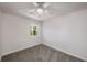 Comfortable bedroom with new carpet, ceiling fan, and serene views from the window at 846 Brandy Oaks Ln, Stone Mountain, GA 30088