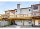 Exterior of a multi-level home with wooden decks and a covered patio, surrounded by a wooded area at 846 Brandy Oaks Ln, Stone Mountain, GA 30088