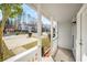 Cozy covered front porch with white columns, offering a welcoming view of the quiet neighborhood at 846 Brandy Oaks Ln, Stone Mountain, GA 30088
