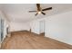 Bright living room featuring wood-look flooring, white walls, and a cozy fireplace at 846 Brandy Oaks Ln, Stone Mountain, GA 30088